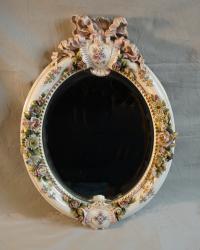 Antique Meissen porcelain oval mirror with flowers and ribbon