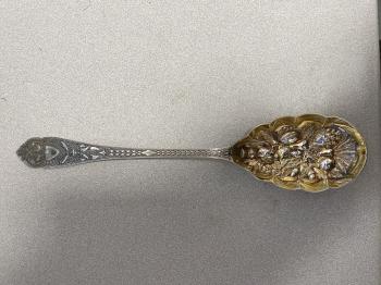 Image of Sheffield silver serving spoon with gold vermeil