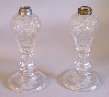 Image of Pair glass oil lamps in diamond pattern on candlestick bases
